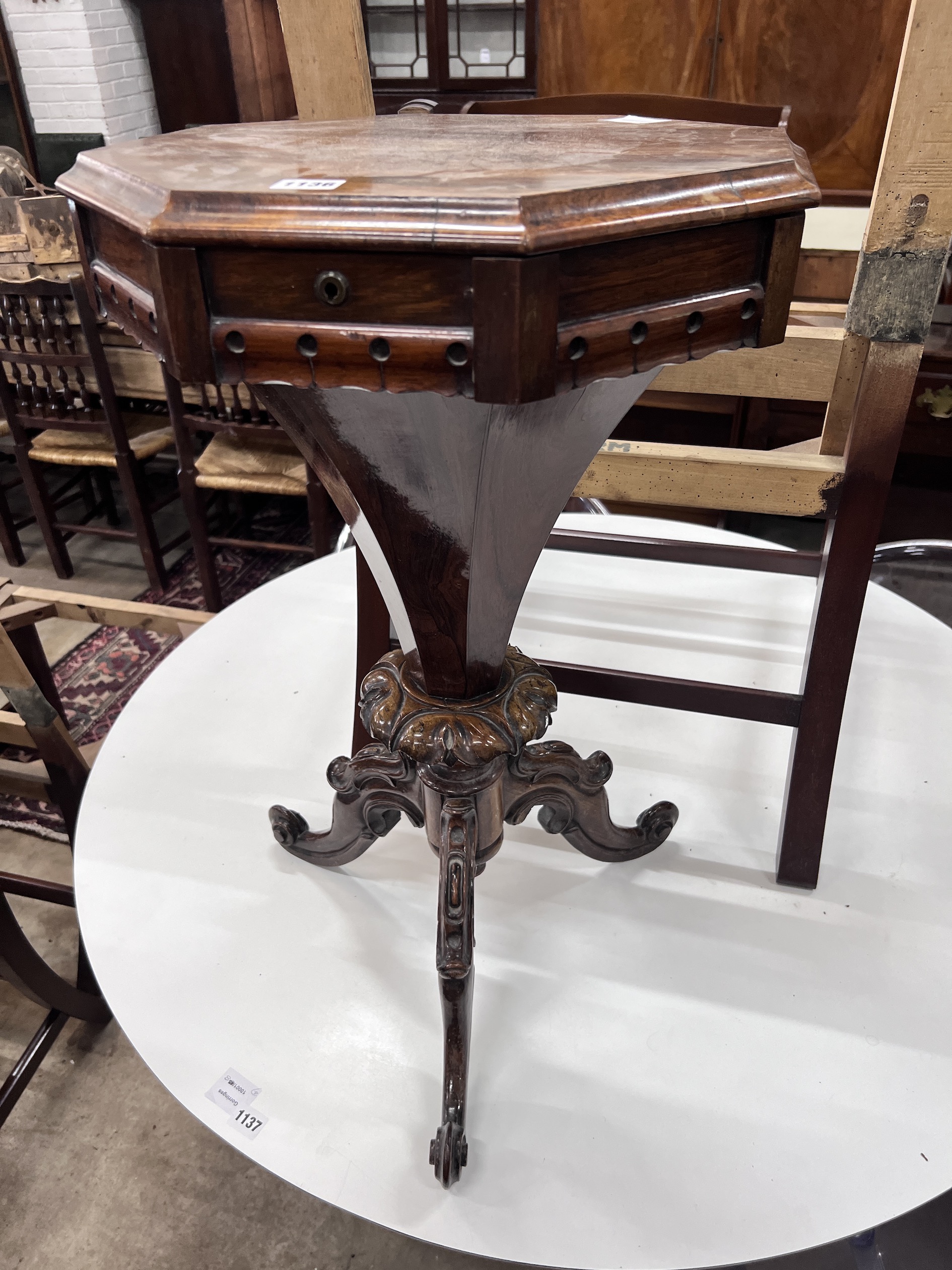 A Victorian octagonal rosewood trumpet work table, width 44cm, height 74cm